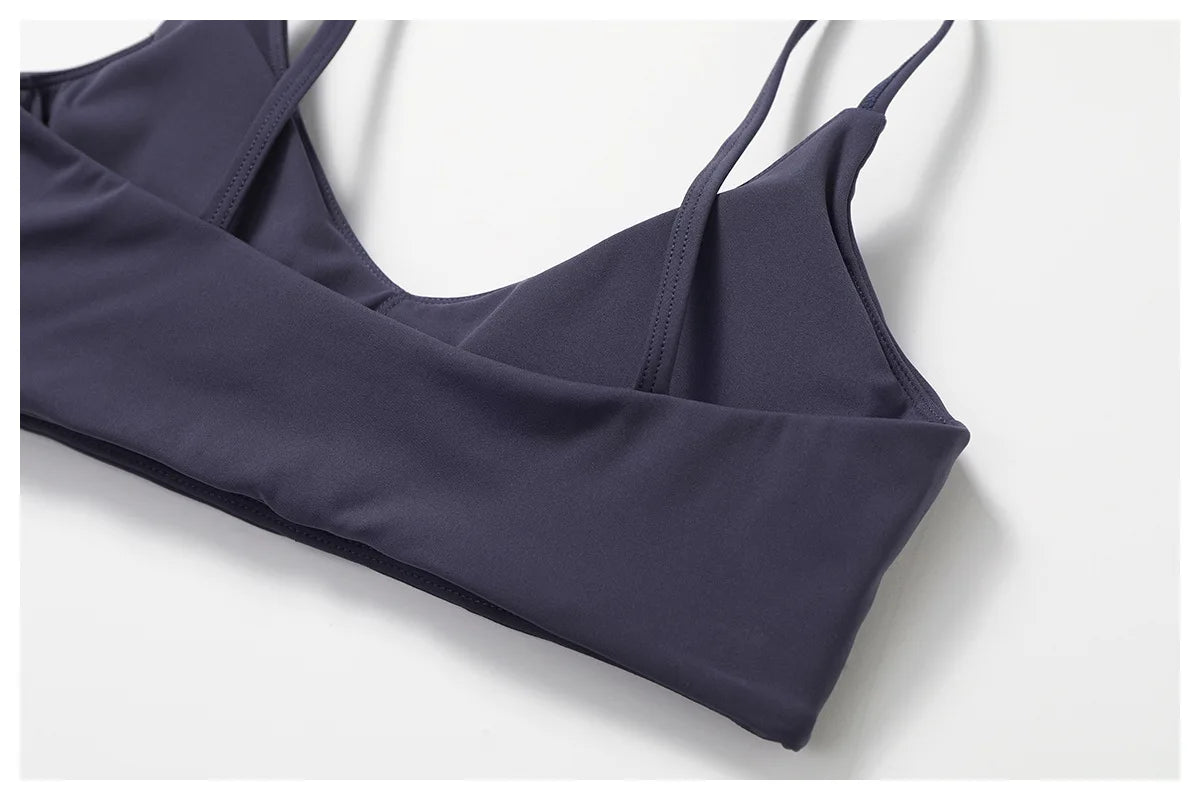 Two-piece women's fitness set by The Clothing Company Sydney, includes short sleeve crop top, sports bra, and gym leggings with bike shorts.