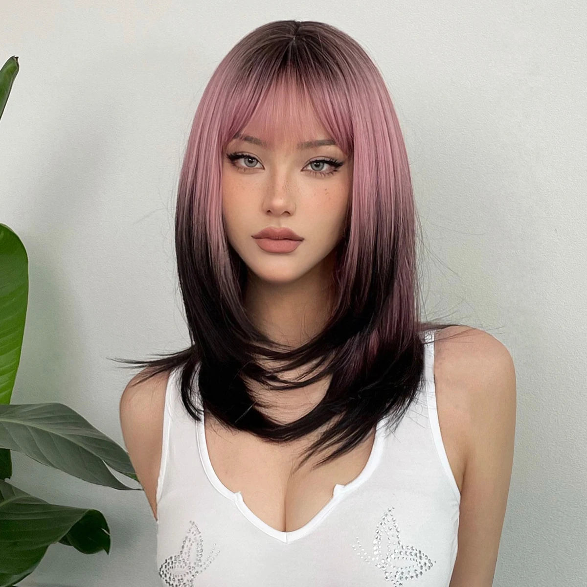 Long layered straight synthetic wig with black and pink ombre colors, perfect for cosplay and women's fashion by The Clothing Company Sydney