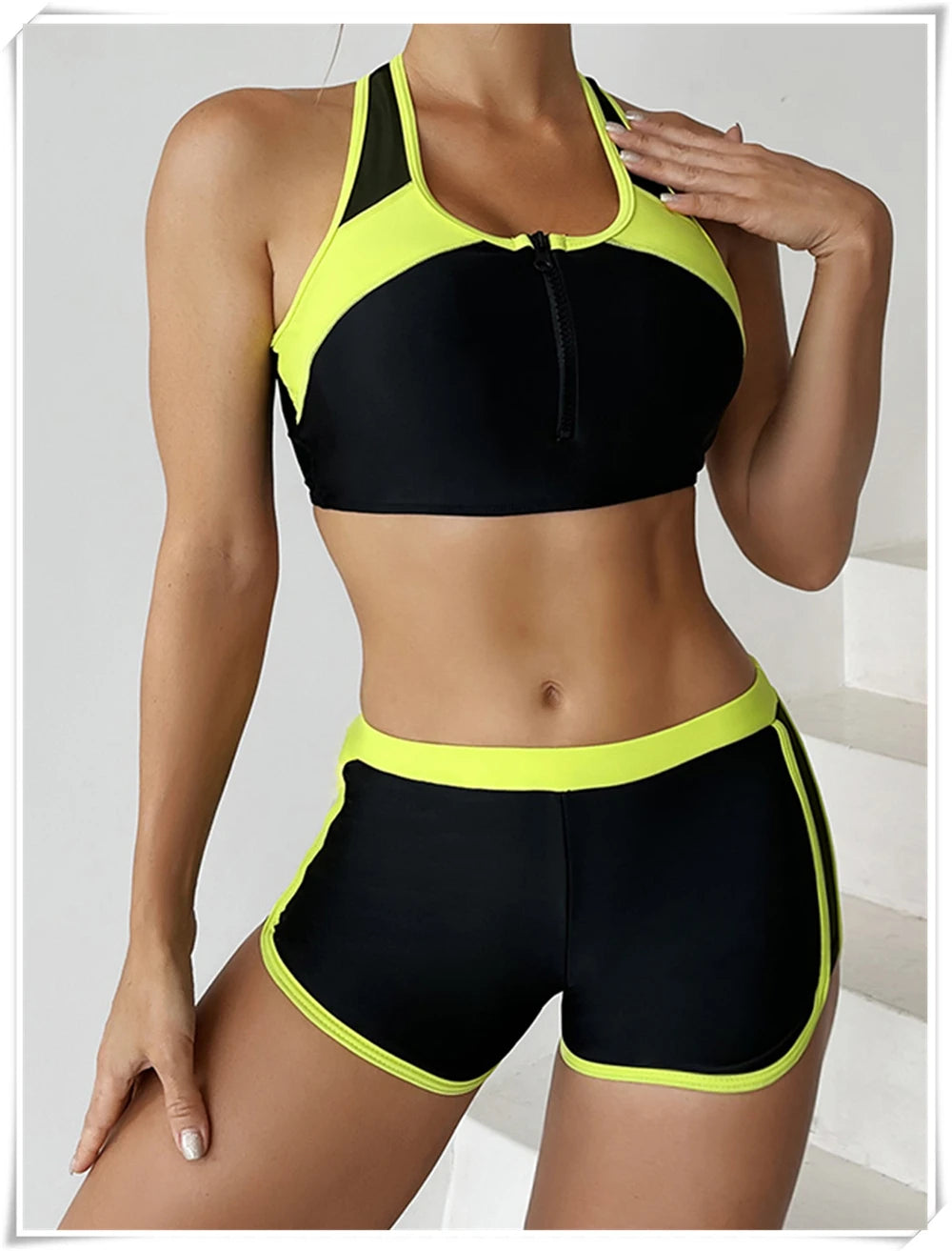 Two-piece swimsuit by The Clothing Company Sydney featuring a zipper tankini top and high-waist shorts for summer beachwear.
