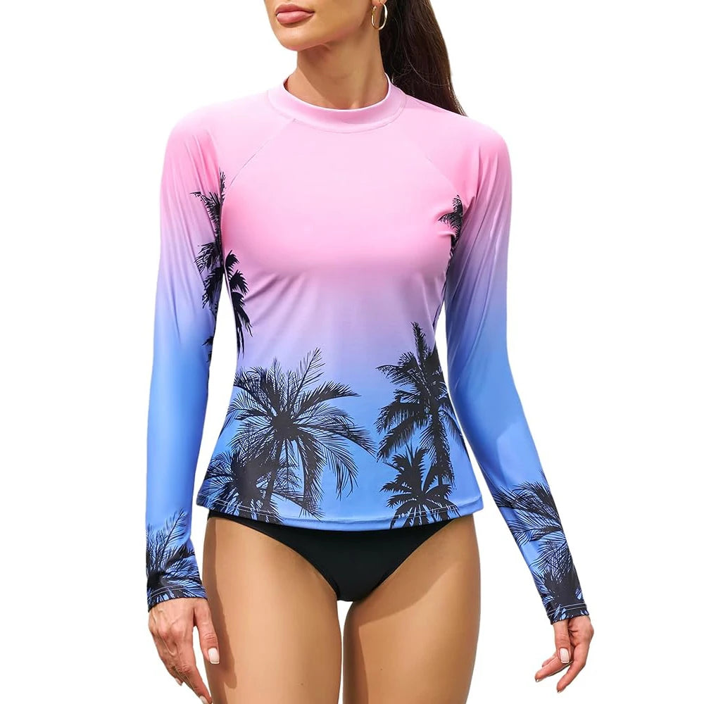Women's long sleeve printed rashguard swimsuit with thumb holes, crew neck, skin-friendly UPF 50+ for surfing by The Clothing Company Sydney