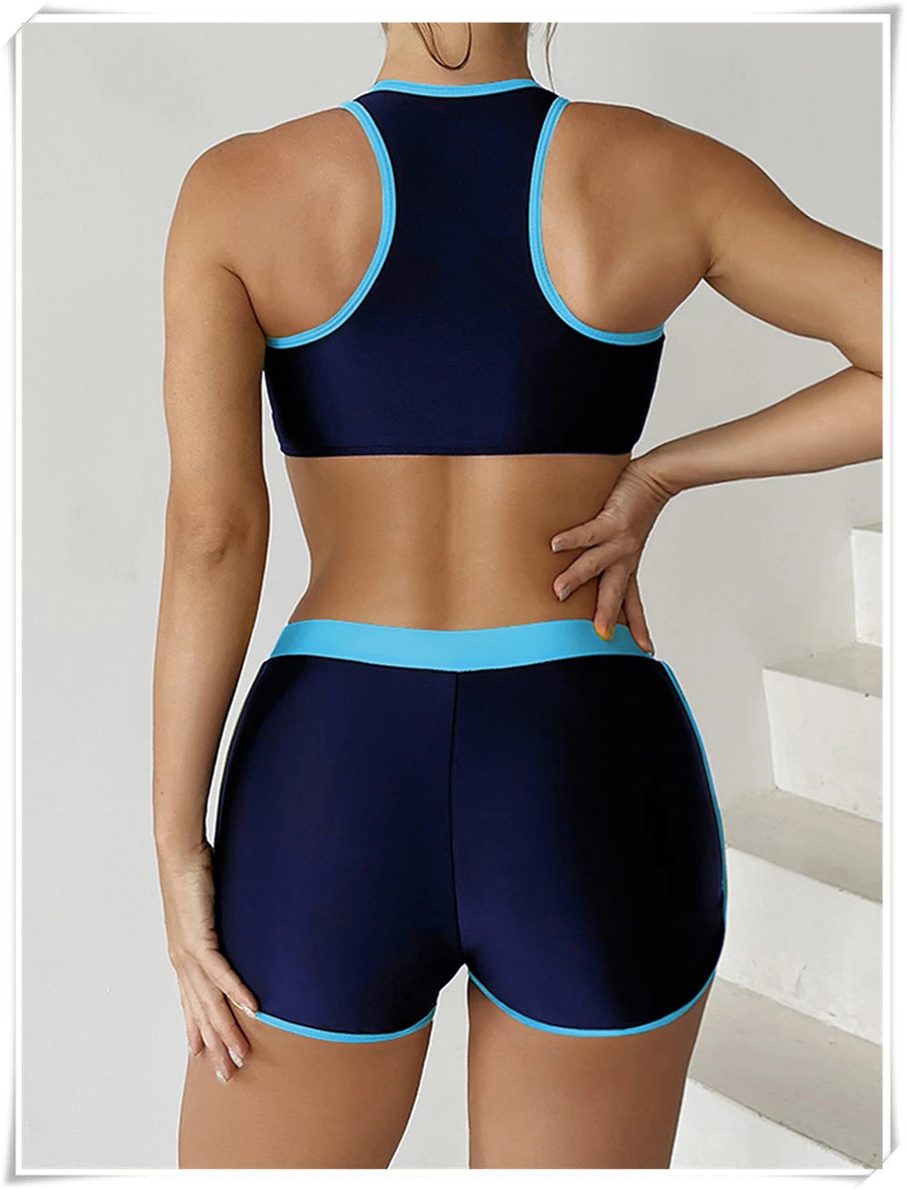Two-piece swimsuit by The Clothing Company Sydney featuring a zipper tankini top and high-waist shorts for summer beachwear.