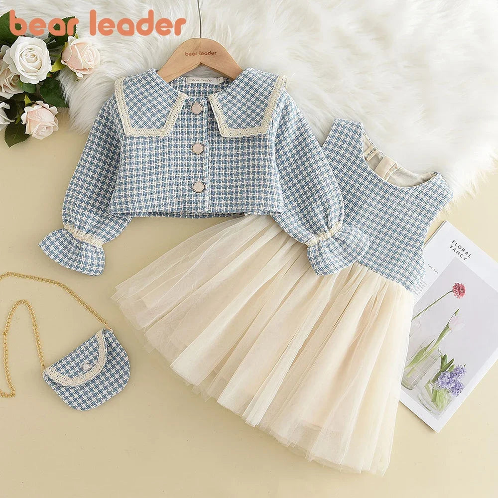 Three-piece girls' spring and autumn plaid vest, dress, and coat set by The Clothing Company Sydney, featuring retro and fashion-forward styles.