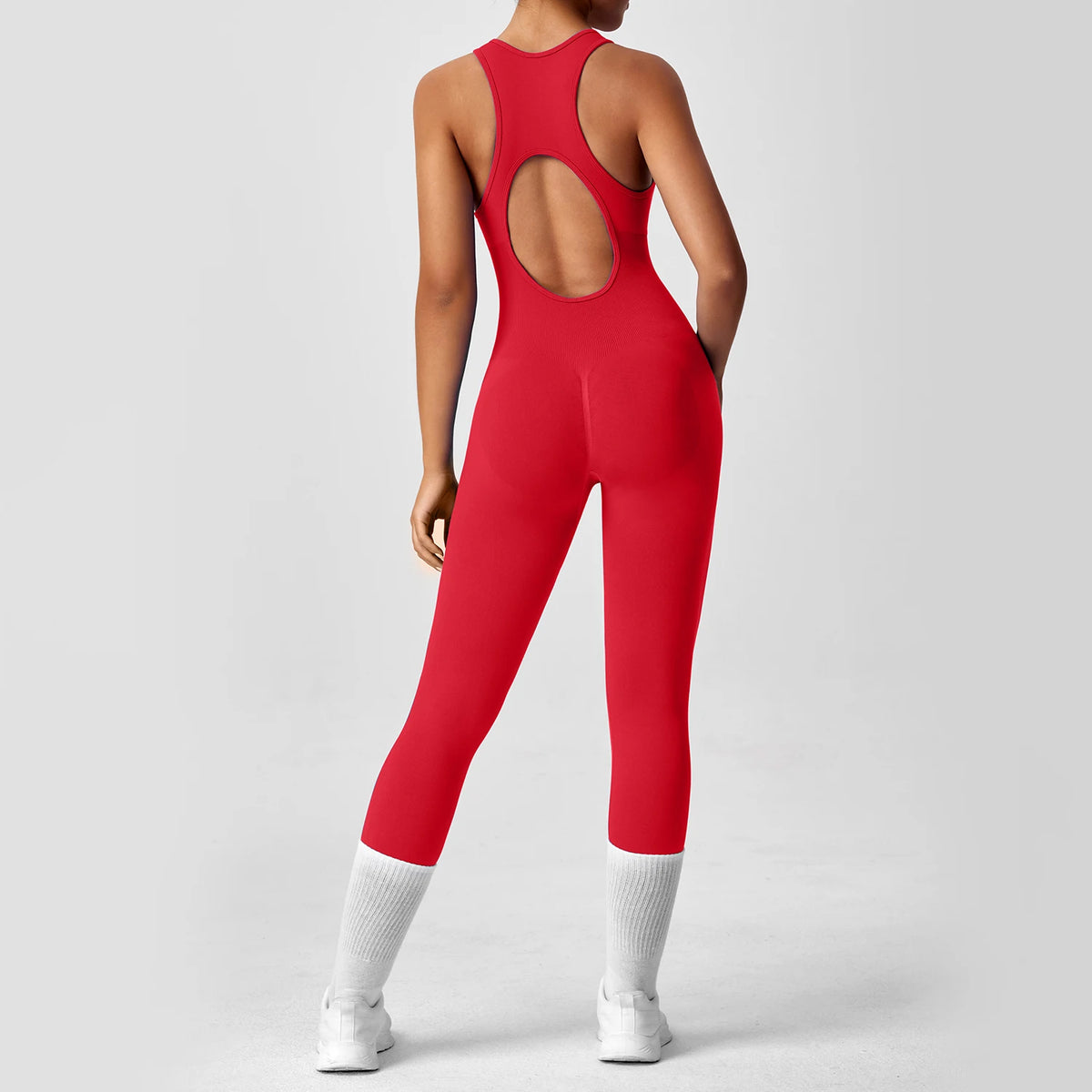 Seamless peach-colored women's yoga bodysuit with V-back design, ideal for gym workouts and activewear from The Clothing Company Sydney