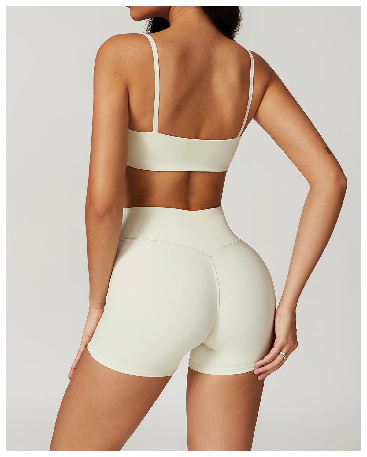 Two-piece women's fitness sportswear set from The Clothing Company Sydney, includes crop top, sports bra, leggings, and bike shorts.