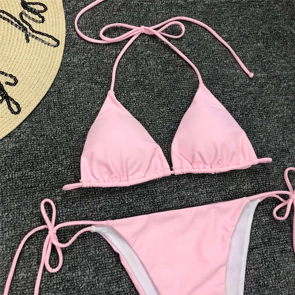 Neon pink Brazilian bikini swimsuit for women, halter style two-piece swimwear, by The Clothing Company Sydney.
