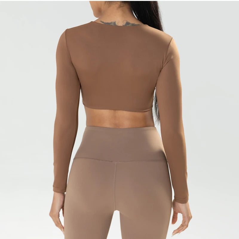 Long sleeve gym crop top by The Clothing Company Sydney with twist detail, deep V neckline, quick-dry fabric, padded for fitness and yoga.