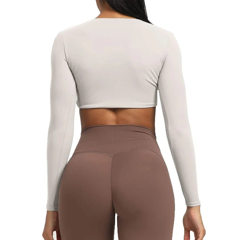 Long sleeve gym crop top by The Clothing Company Sydney featuring twist design, deep V neck, padded, quick-dry fabric for fitness and yoga.