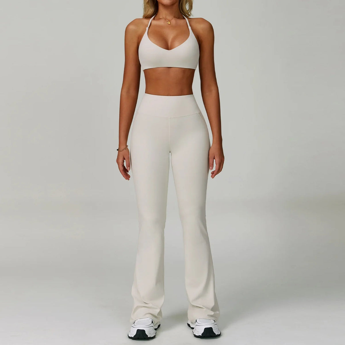 Two-piece women's fitness tracksuit with high-waist leggings and workout bra from The Clothing Company Sydney, suitable for yoga and gym workouts.