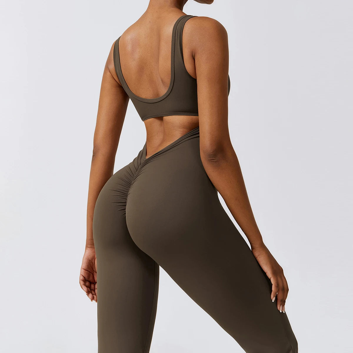 Open back V jumpsuit gym set by The Clothing Company Sydney, women's fitness bodysuit for yoga, training, and stretch workouts.