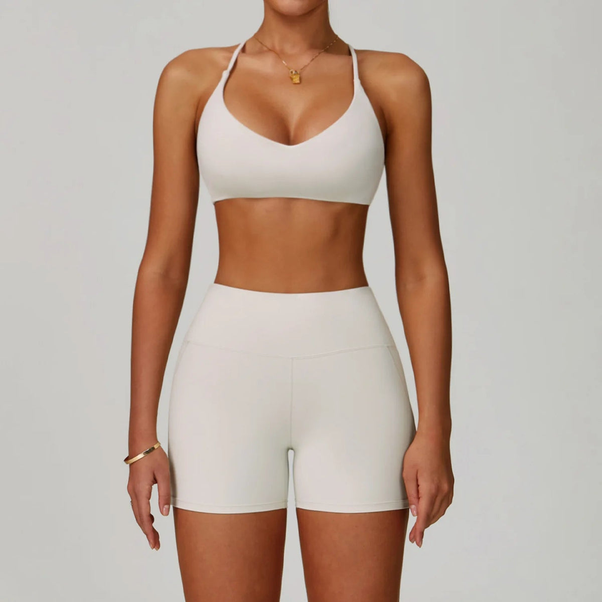 Women's fitness tracksuit set from The Clothing Company Sydney, includes high-waist leggings and sports bra for yoga and workout.