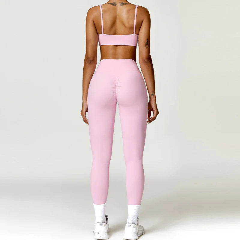 Two-piece women's fitness tracksuit by The Clothing Company Sydney, featuring sporty leggings and a matching workout top.