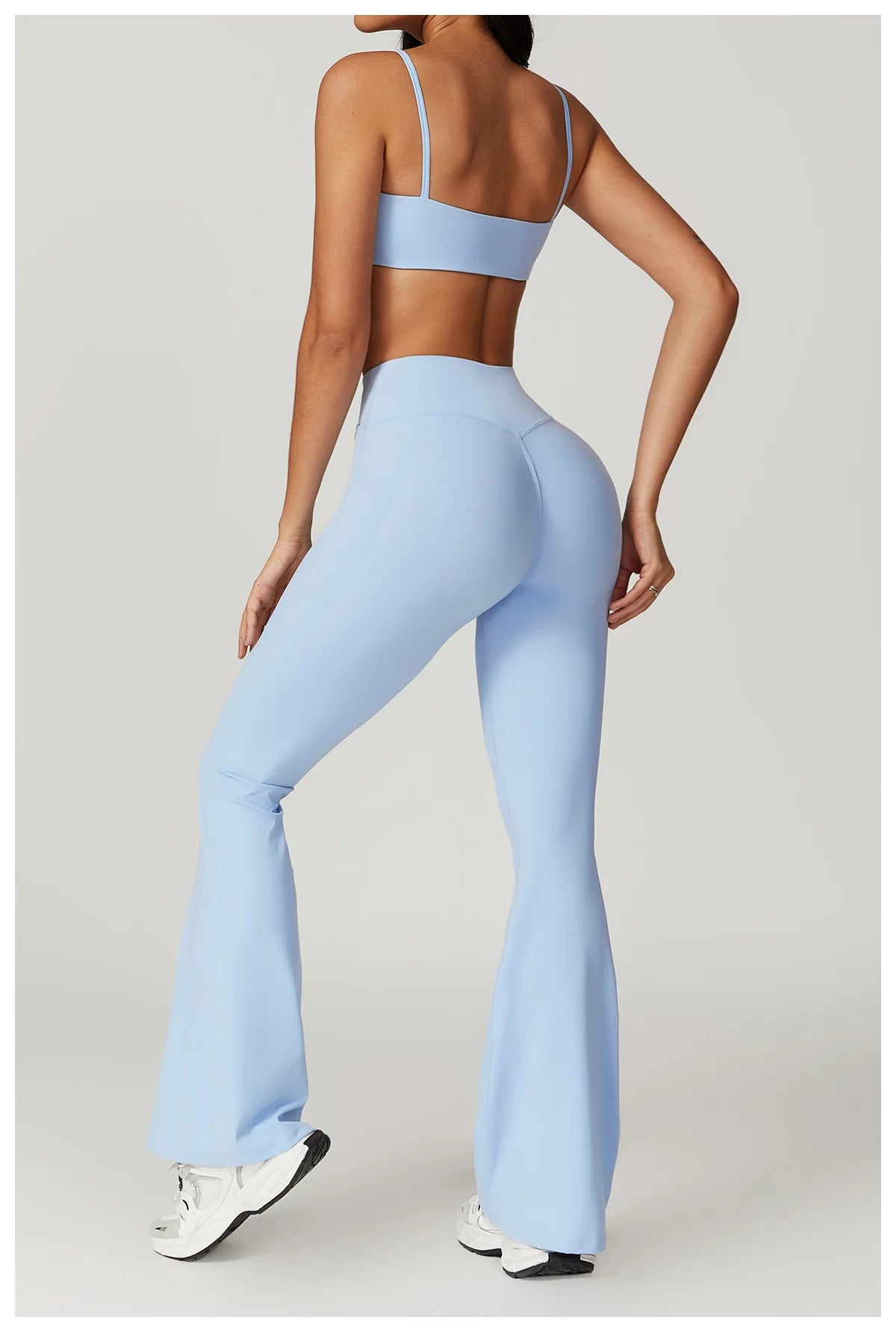 Two-piece women's fitness set with short sleeve crop top and gym leggings, sports bra, and bike shorts from The Clothing Company Sydney.