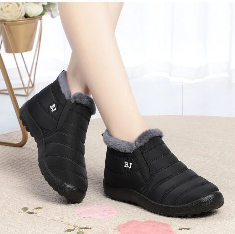 Women’s waterproof fur snow boots by The Clothing Company Sydney, slip-on ankle shoes with warm fur lining and rugged soles.