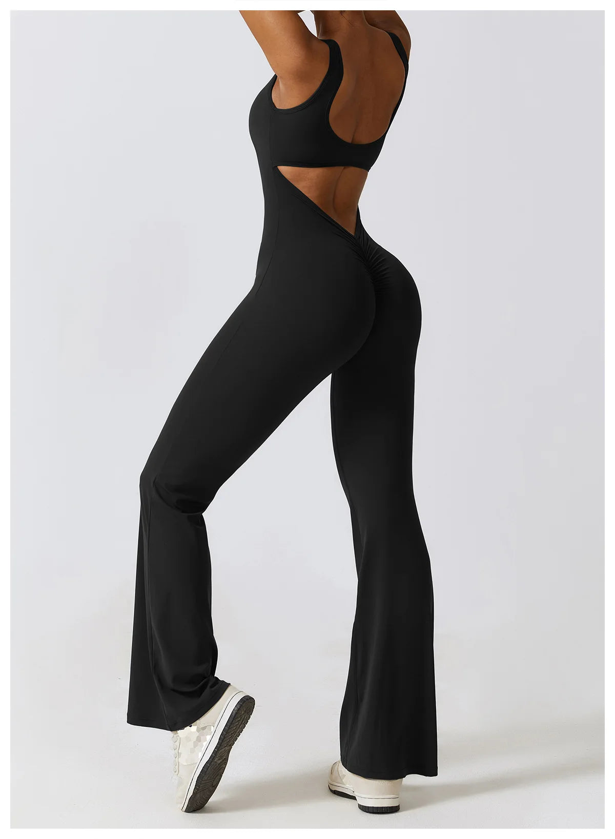 Open back V-neck gym jumpsuit for women by The Clothing Company Sydney, showing a stretch fabric fitness bodysuit for yoga and workout training.