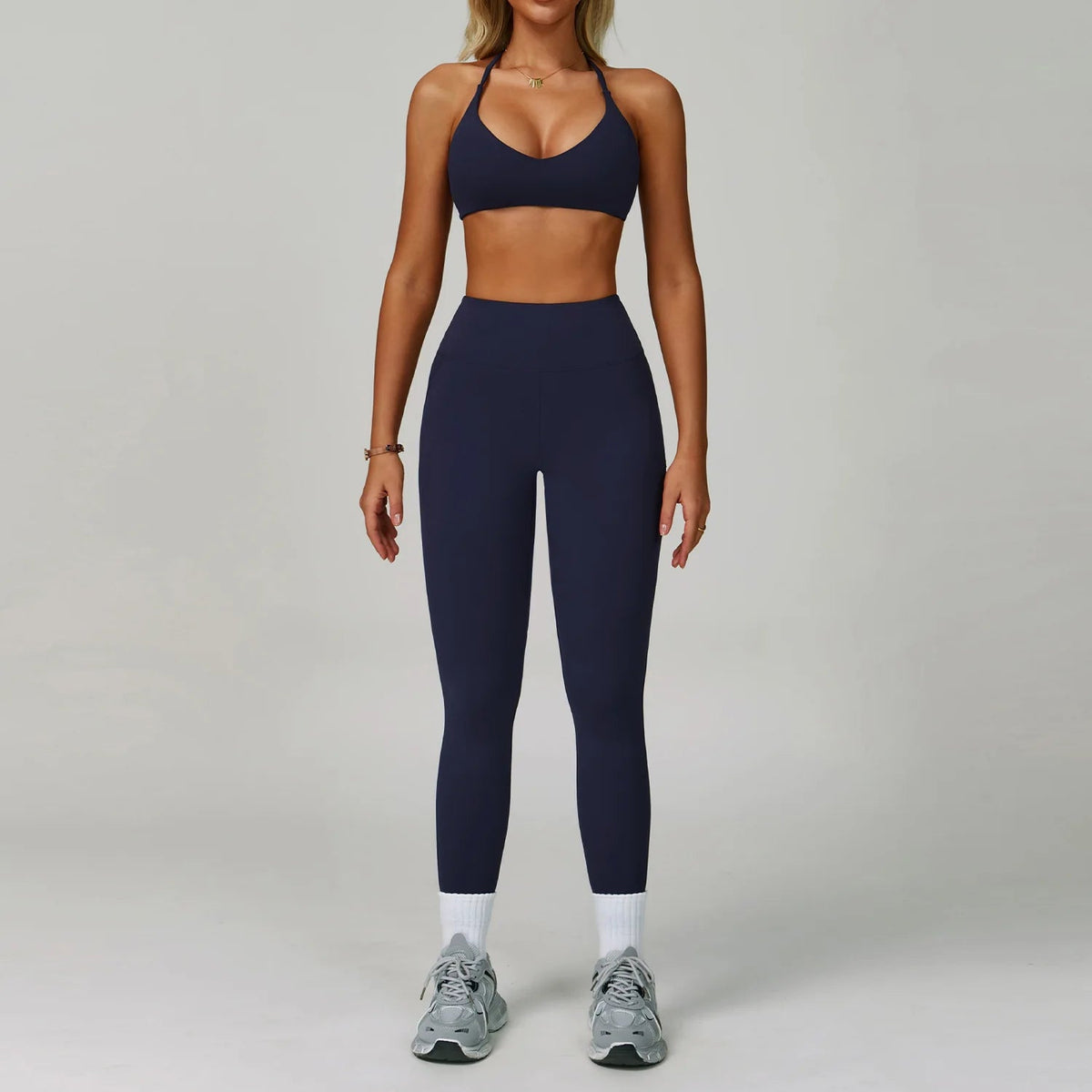 Women's fitness tracksuit set by The Clothing Company Sydney with high waist leggings and sports bra for yoga and workout activities.