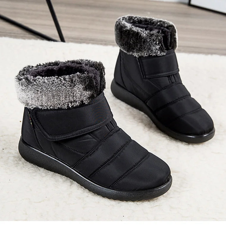 Women's fur-lined waterproof ankle boots by The Clothing Company Sydney with plush insoles and rubber soles for winter warmth.