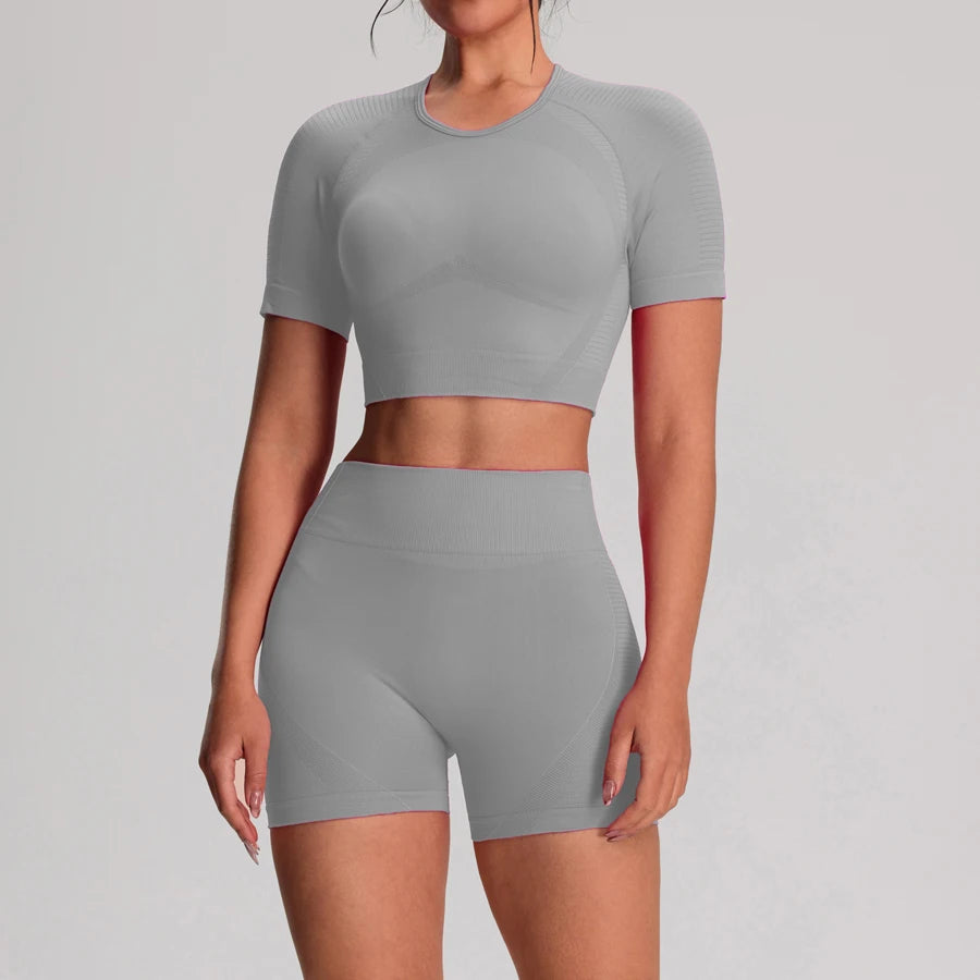 Women's 2-piece yoga and workout shorts set by The Clothing Company Sydney, includes seamless vest, shorts, and leggings for active fitness.