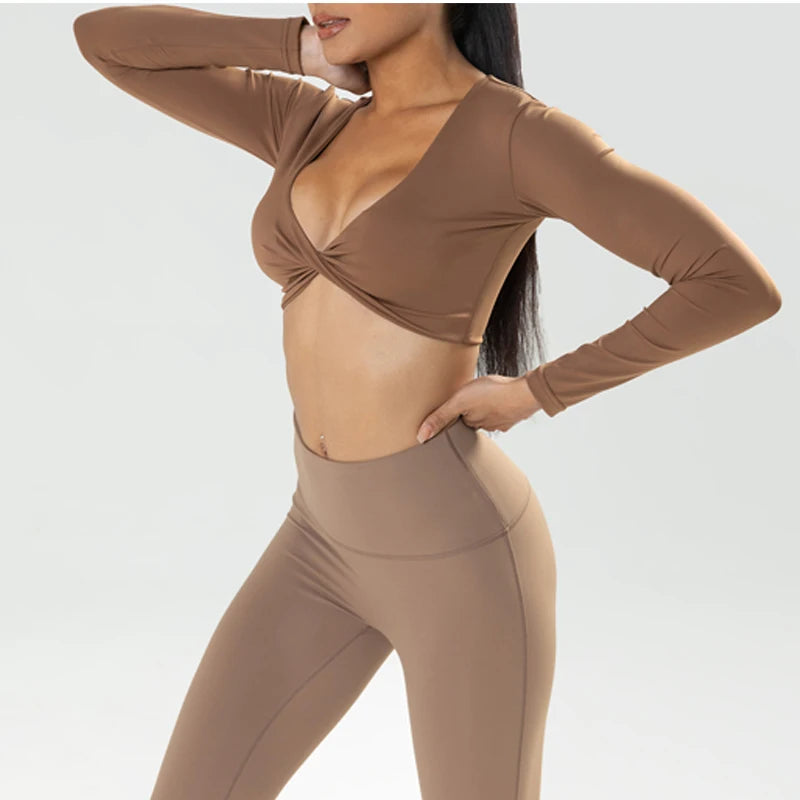 Fitness long sleeve gym crop top by The Clothing Company Sydney with twist detail, deep V neckline, quick-dry fabric, and padding for workout and yoga