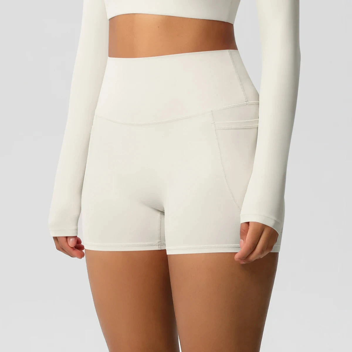 High-waisted bicycle yoga pants by The Clothing Company Sydney with pockets, quick-drying, breathable fabric and push-up fit for women.