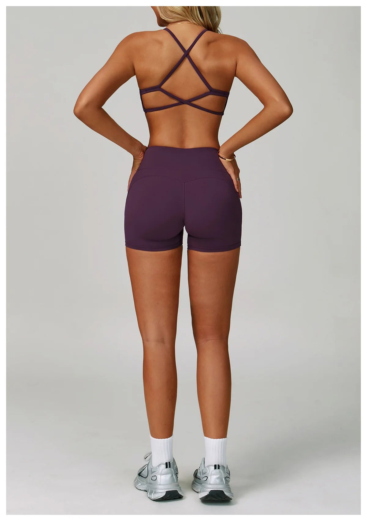 Women's fitness tracksuit set with high-waist leggings and sports bra, from The Clothing Company Sydney for yoga and workout.