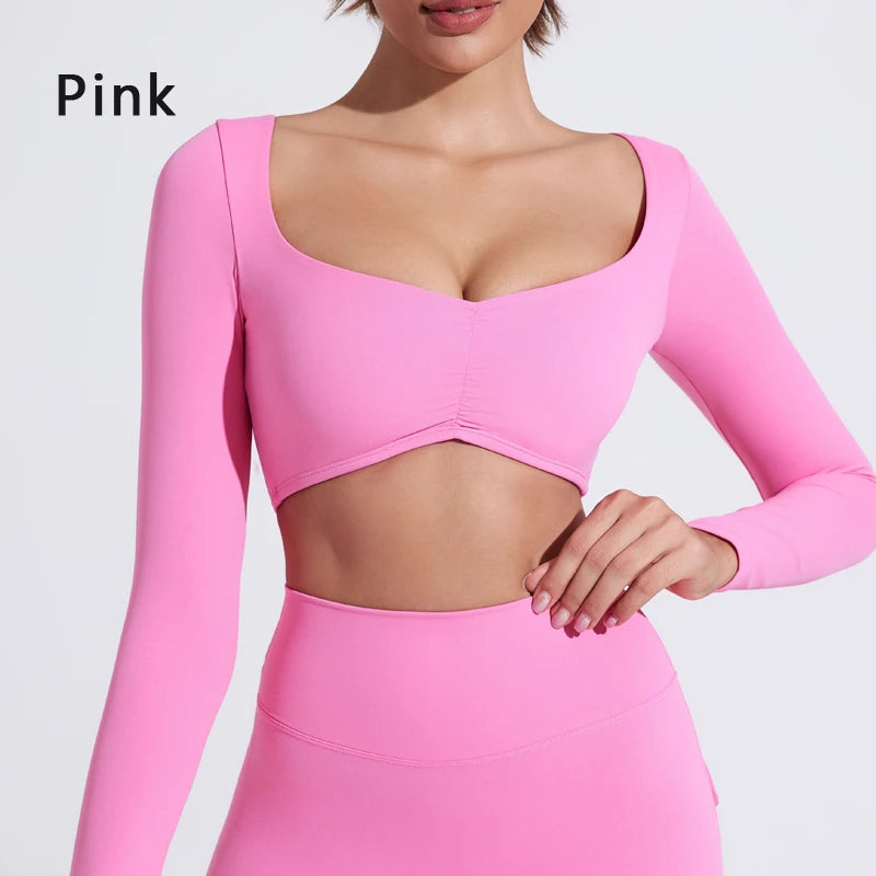 Nylon long-sleeved yoga top by The Clothing Company Sydney, pleated design, fitted waist, ideal for women's fitness and gym workouts.