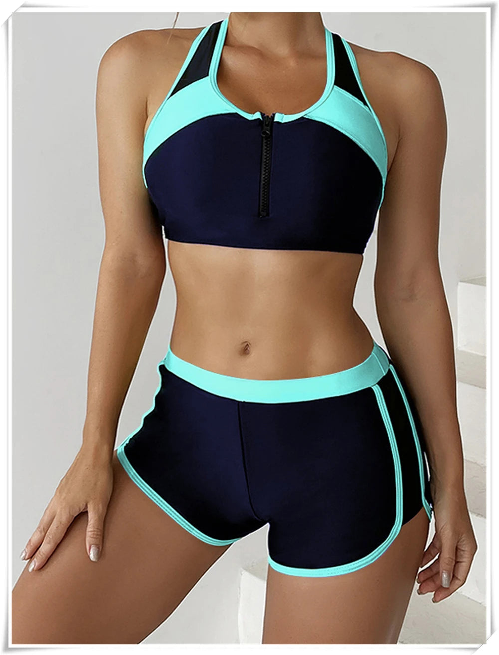Two-piece swimsuit by The Clothing Company Sydney featuring a zipper tankini top and high-waist shorts for summer beachwear.