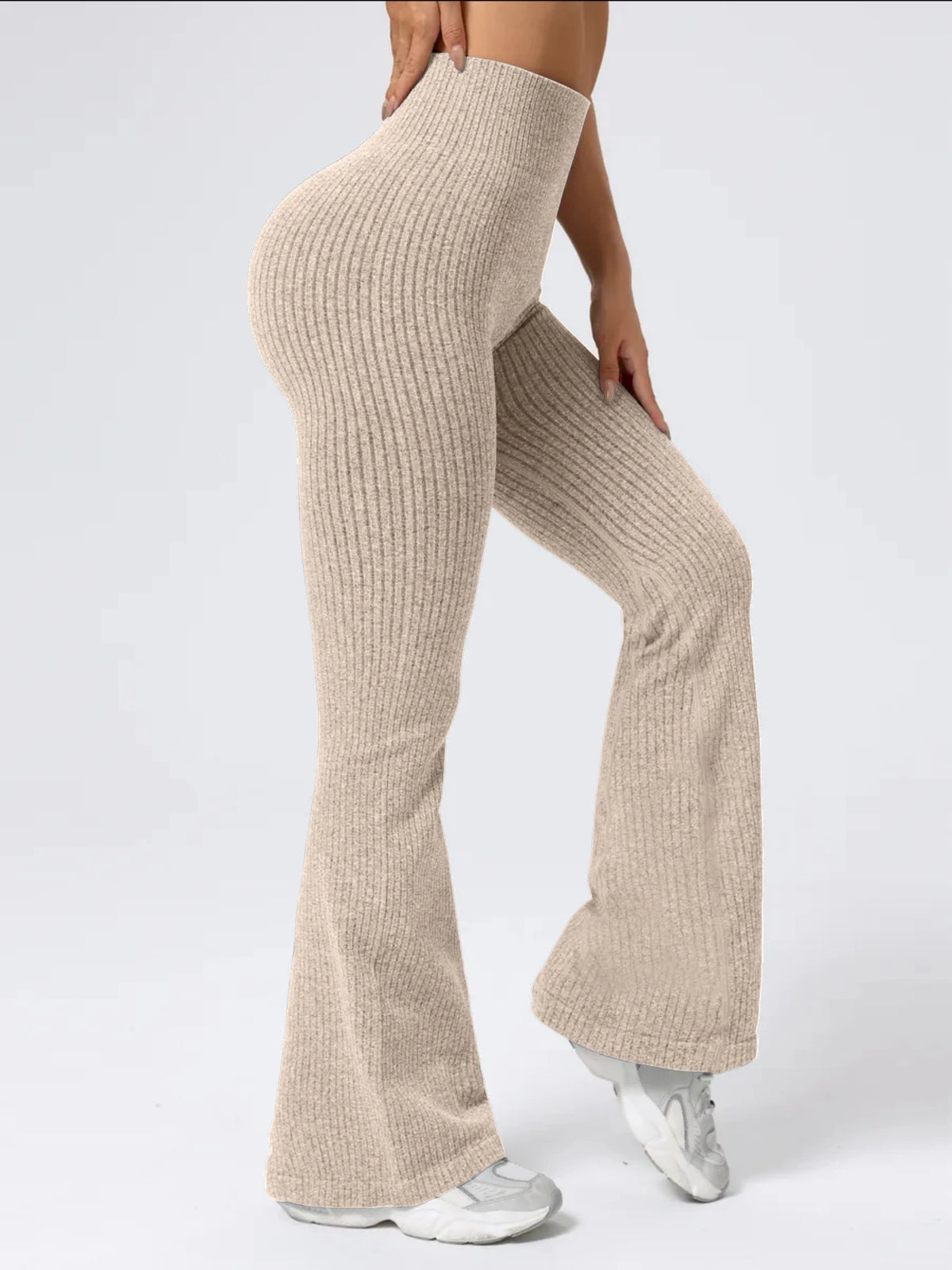 Women's high-waist bell bottom pants from The Clothing Company Sydney, featuring a sporty, tight fit and wide-leg, elastic waistband.