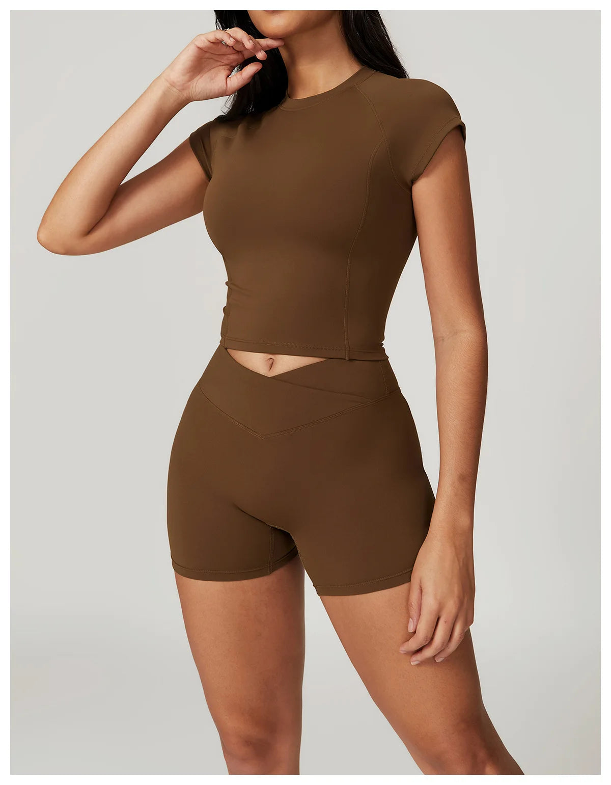Two-piece women's fitness sportswear set including a crop top, sports bra, and leggings by The Clothing Company Sydney, on a white background.