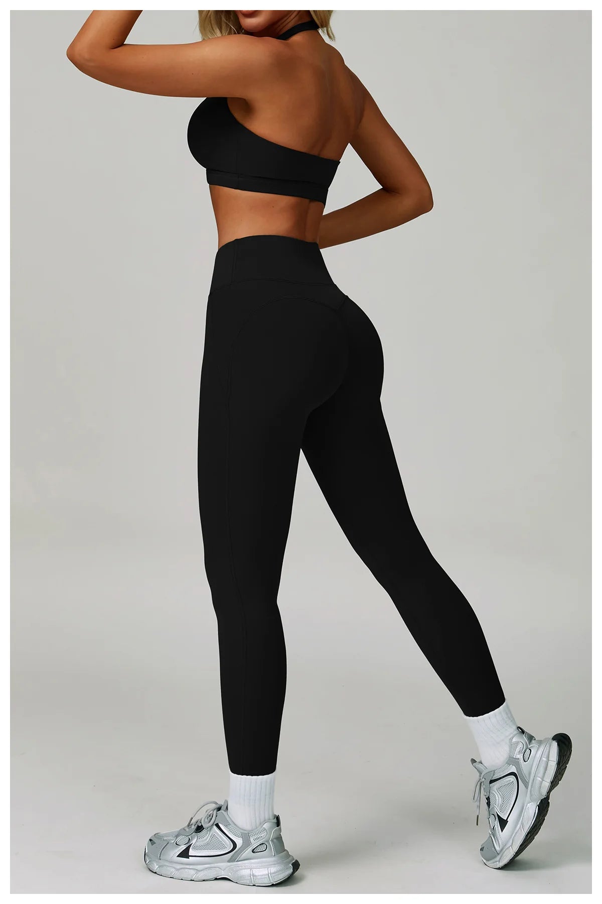 Women's fitness tracksuit set by The Clothing Company Sydney featuring high waist leggings and a sports bra for workout and yoga.