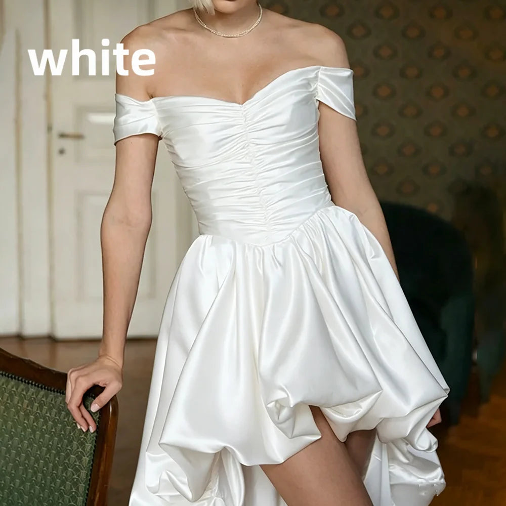 Satin off-shoulder bridal gown with ruched bodice, lace-up back, short front and long train wedding dress