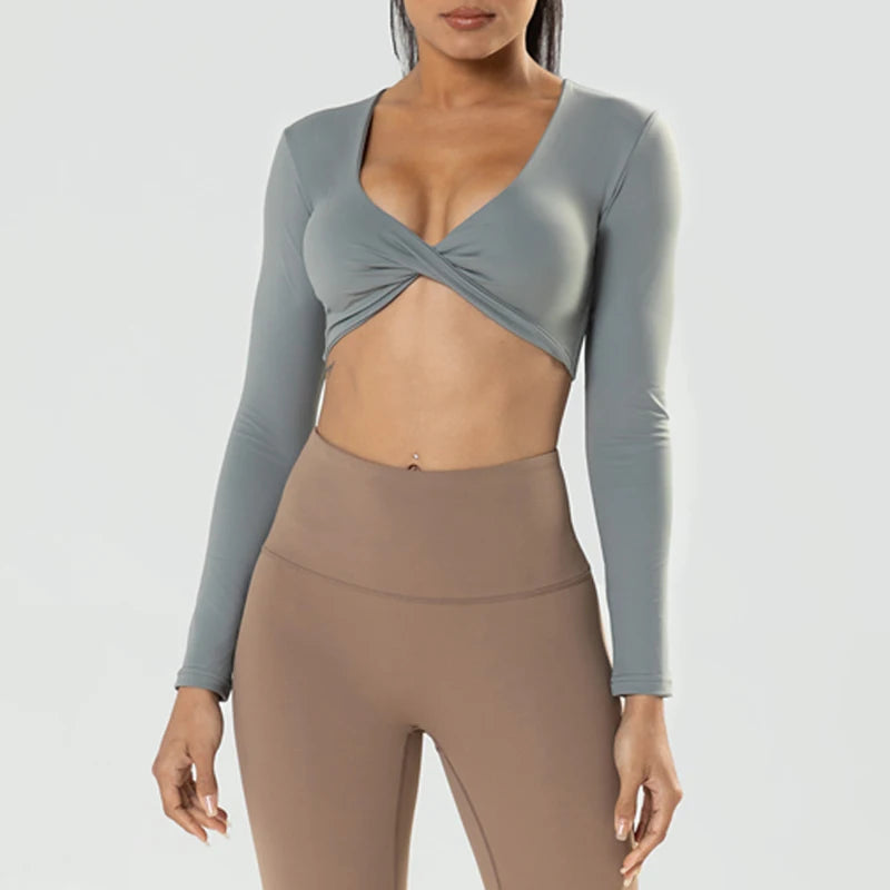Long sleeve fitness crop top by The Clothing Company Sydney with twist deep V neckline, quick-dry fabric, padded for workout and yoga.