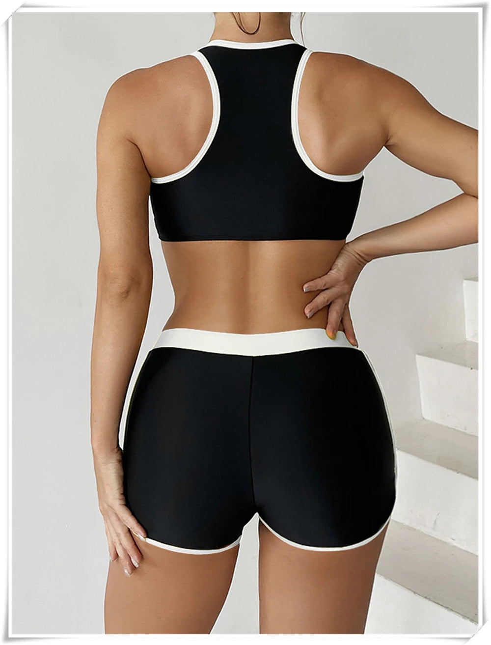 Two-piece swimsuit by The Clothing Company Sydney featuring a zipper tankini top and high-waist shorts for summer beachwear.