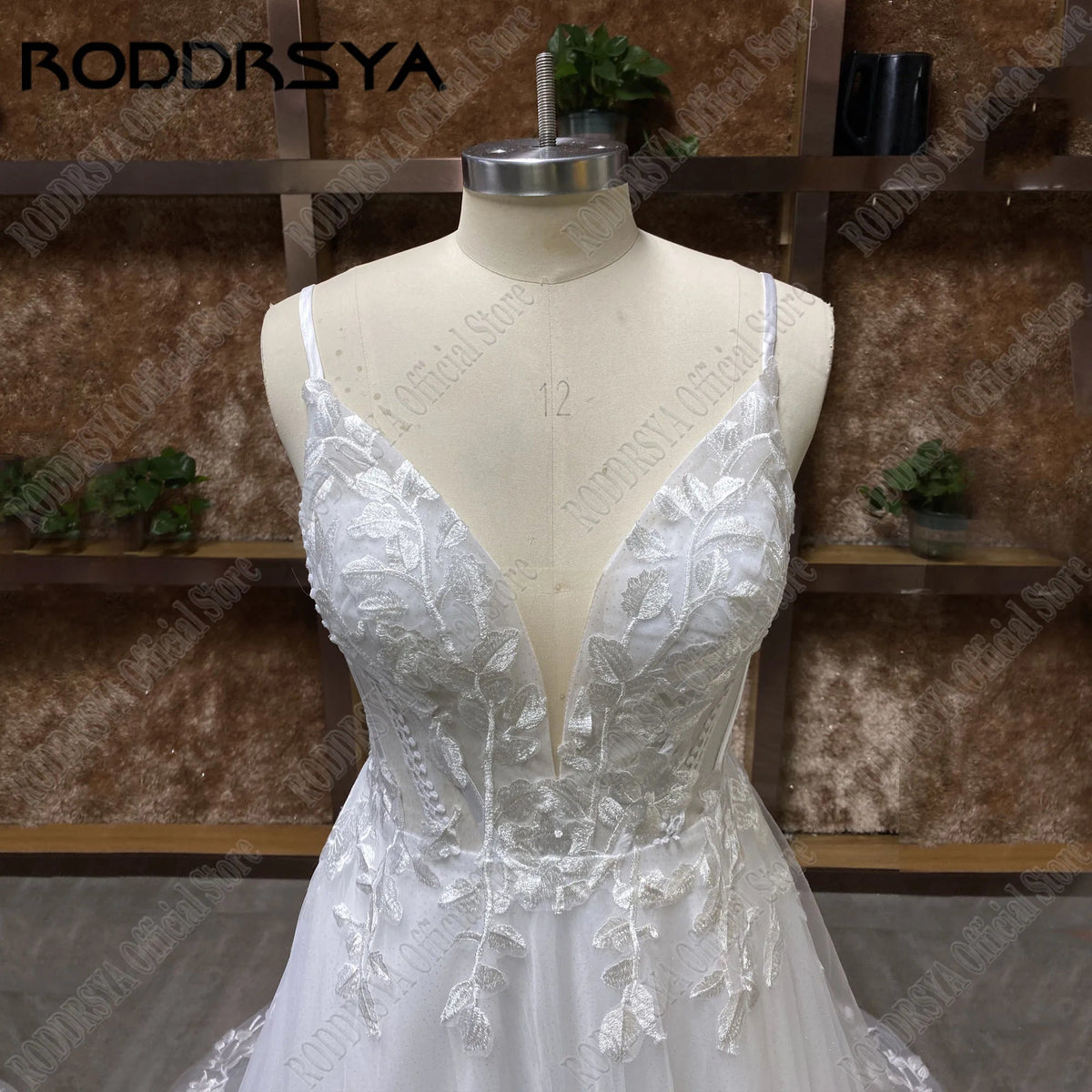 Sparkling wedding dress with spaghetti straps, glitter V-neck, backless design, boho style, sweeping train, from The Clothing Company Sydney.