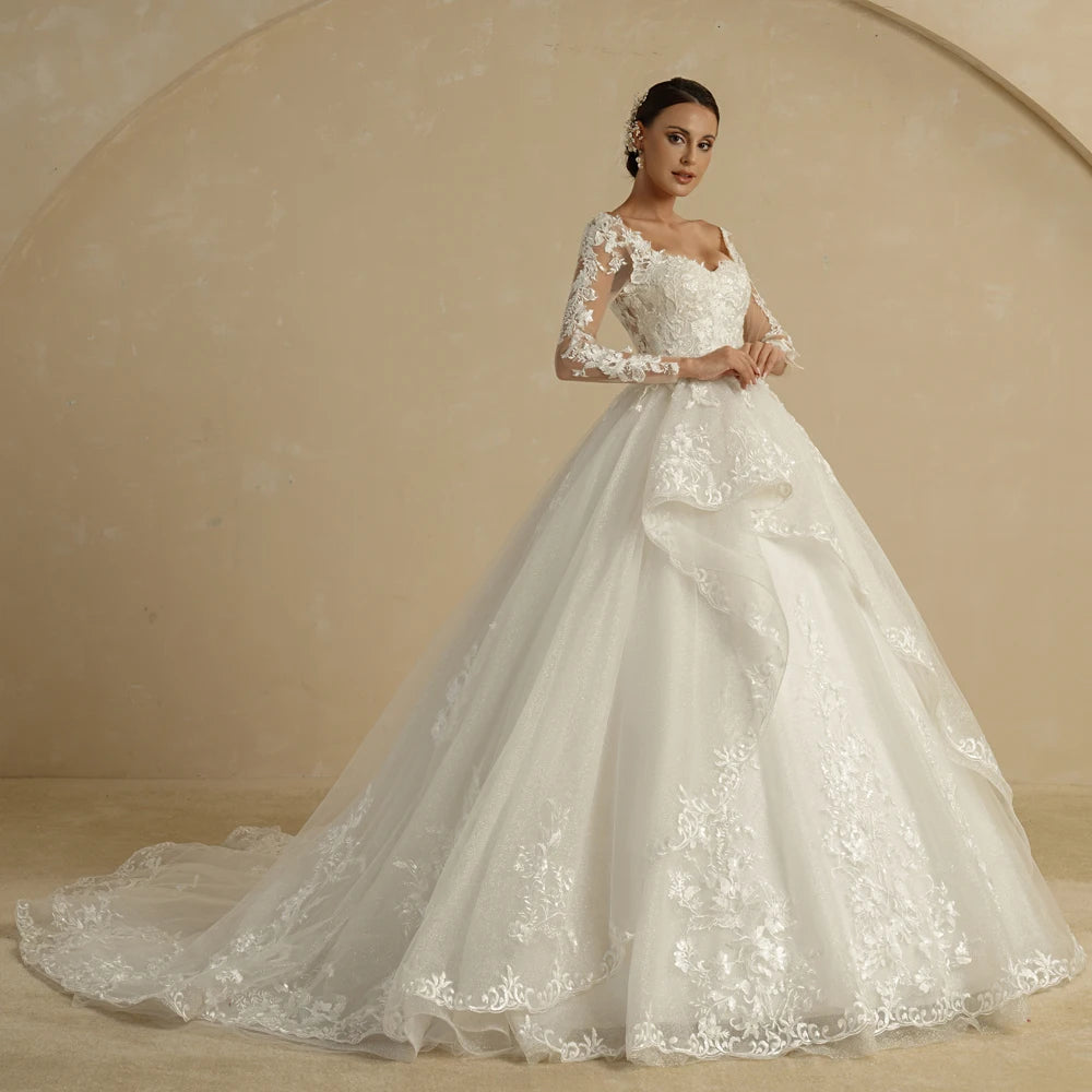 Luxury strapless A-line wedding dress with off-the-shoulder neckline, ivory glitter fabric, designed for brides by The Clothing Company Sydney.
