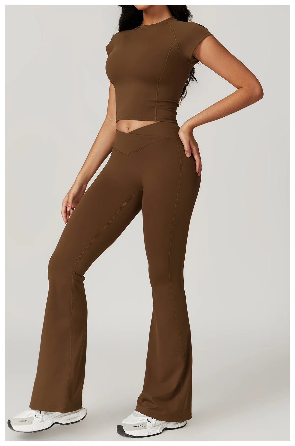 Two-piece women's yoga gym set with short sleeve crop top, sports bra, and leggings from The Clothing Company Sydney.