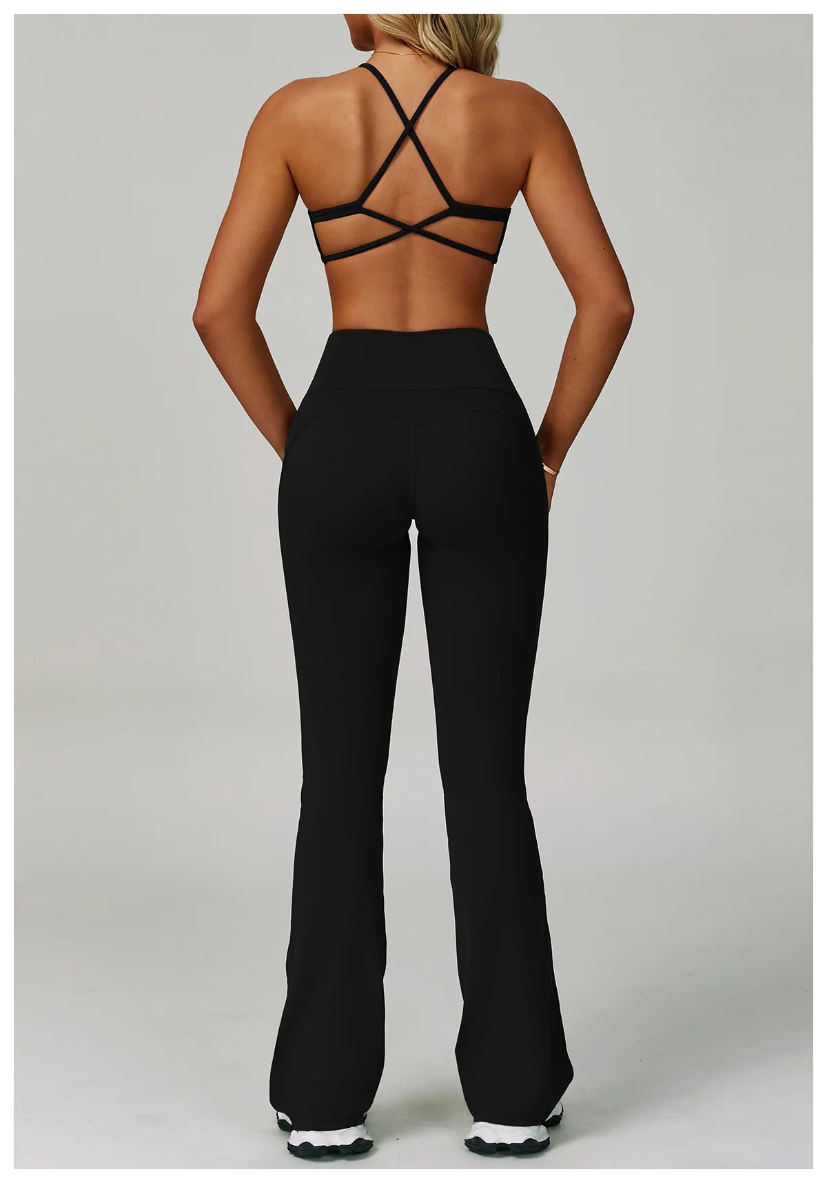 Women's fitness tracksuit set with high waist leggings and sports bra, from The Clothing Company Sydney, ideal for yoga and workout sessions.