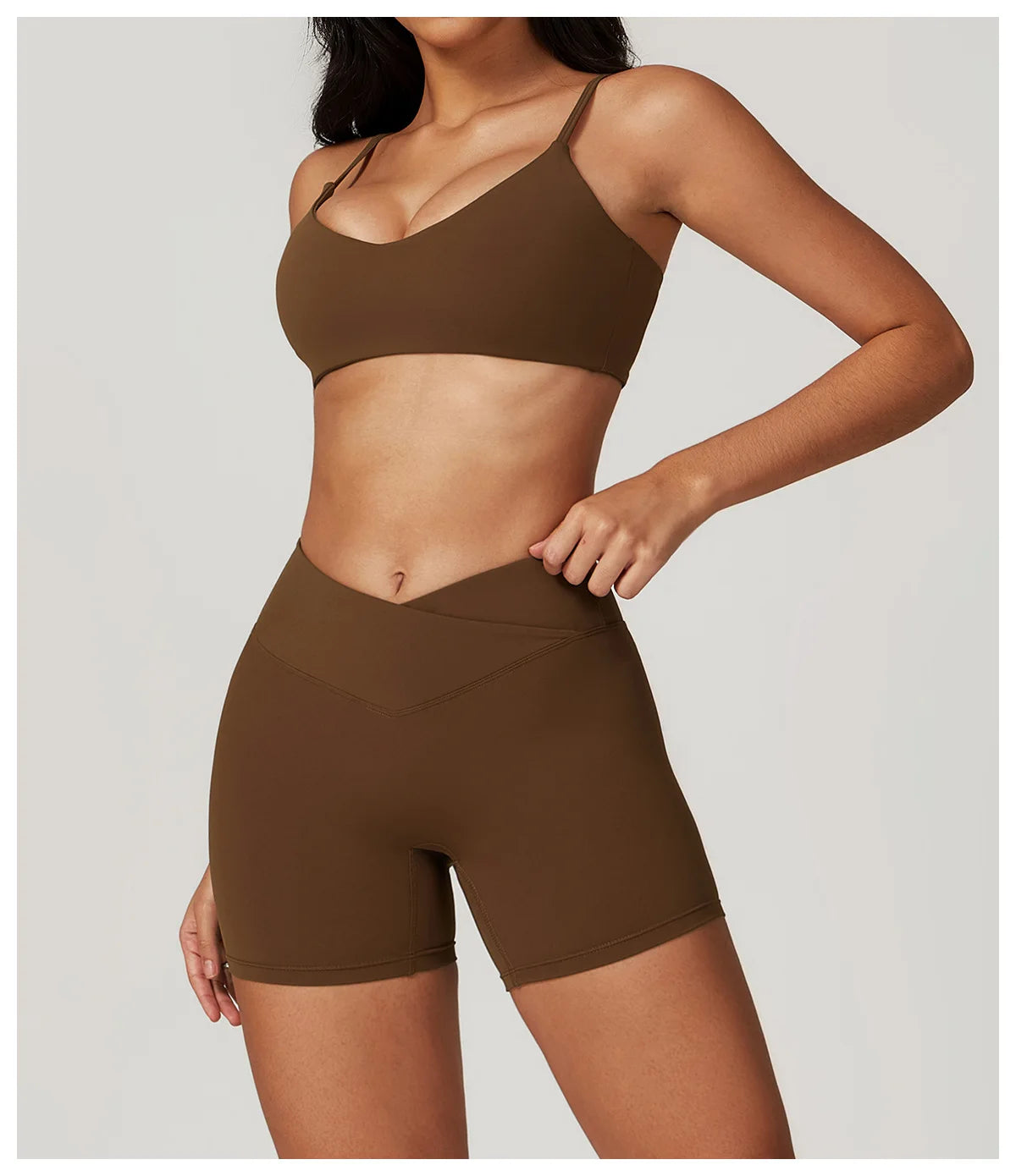 Two-piece women's fitness set with short sleeve crop top, sports bra, and leggings, from The Clothing Company Sydney.