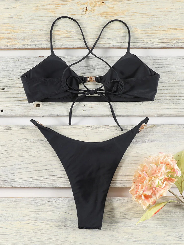 Two-piece push-up bikini set with hollow-out design, low waist style, in vibrant colors, perfect for beach and pool swims.
