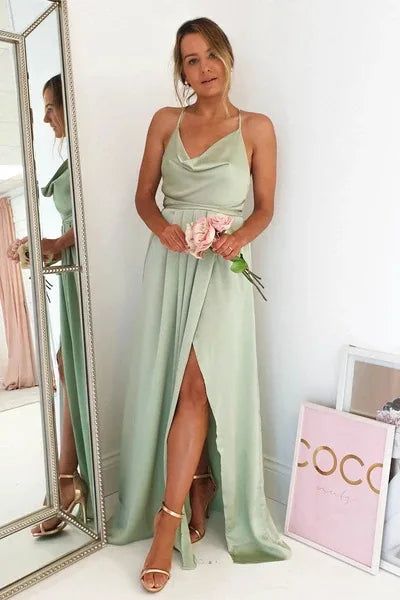 Mint green satin bridesmaid gown with side slit, backless design, spaghetti straps, perfect for summer evening weddings.