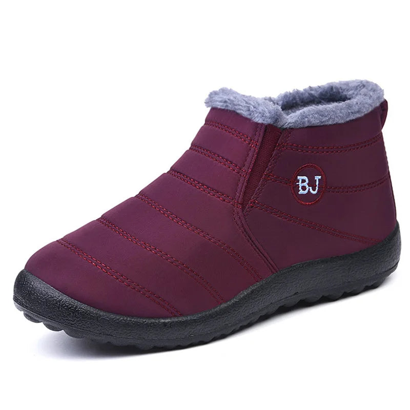 Women’s waterproof fur snow boots by The Clothing Company Sydney, slip-on ankle footwear with cozy fur lining for winter warmth.