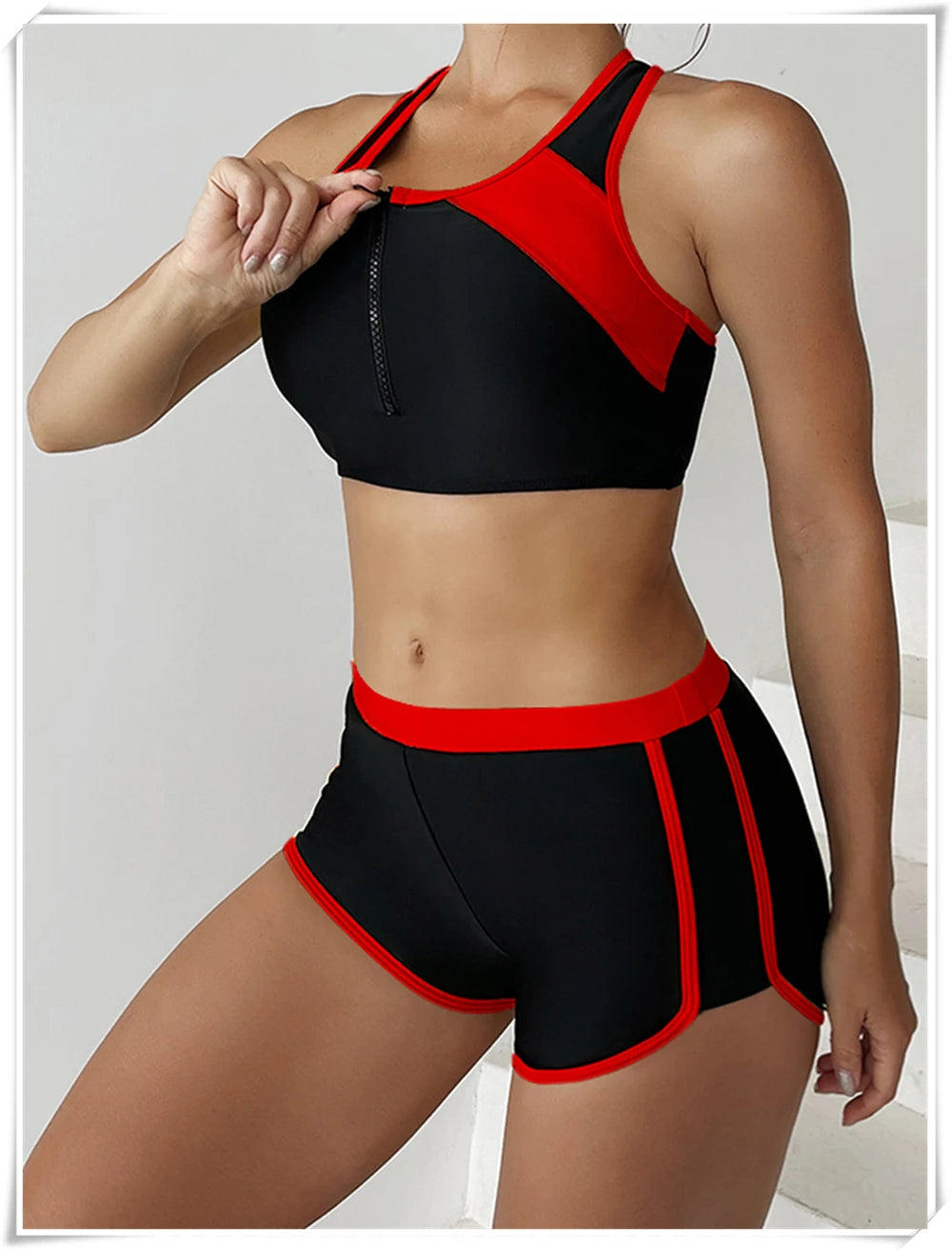 Two-piece swimsuit by The Clothing Company Sydney featuring a zipper tankini top and high-waist shorts for summer beachwear.