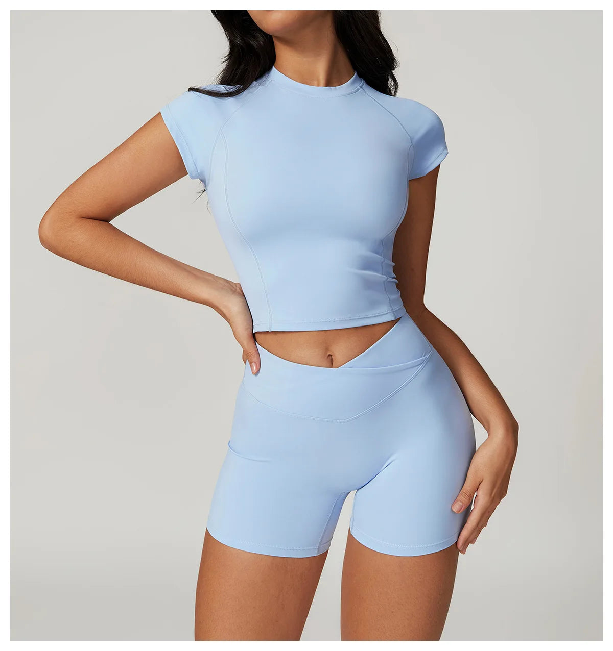 Two-piece women's fitness set with crop top, sports bra, and leggings from The Clothing Company Sydney, ideal for yoga and gym workouts.
