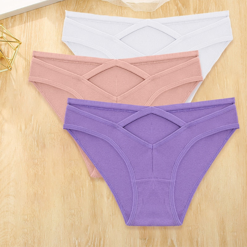 Three cotton blend low-rise briefs from The Clothing Company Sydney featuring front cross design and hollow-out details.
