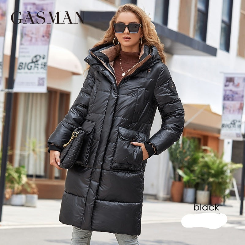 Women's down jacket by The Clothing Company Sydney featuring a long slim design, hood, stand collar, zipper, and large pockets.