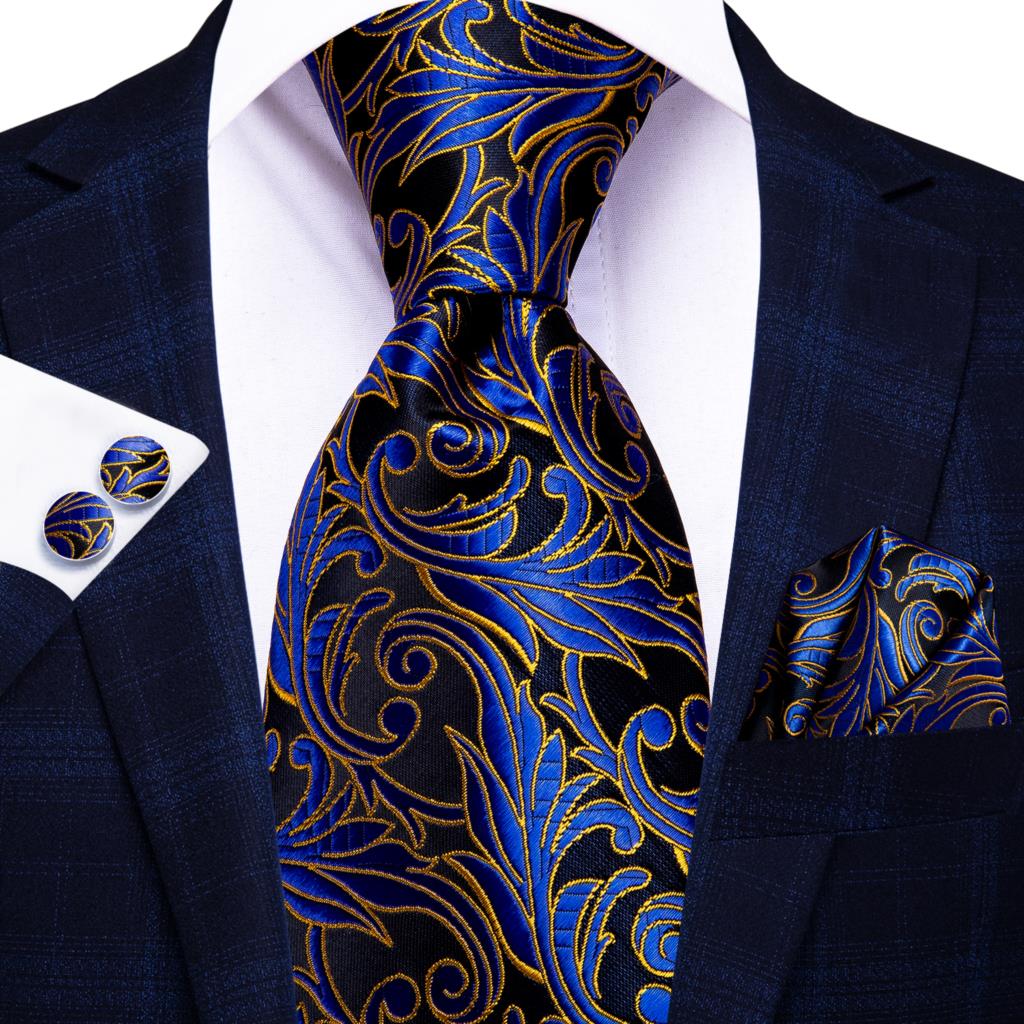 Blue silk men's business tie with dot pattern, plaid cufflinks, and matching accessories for wedding or office attire.