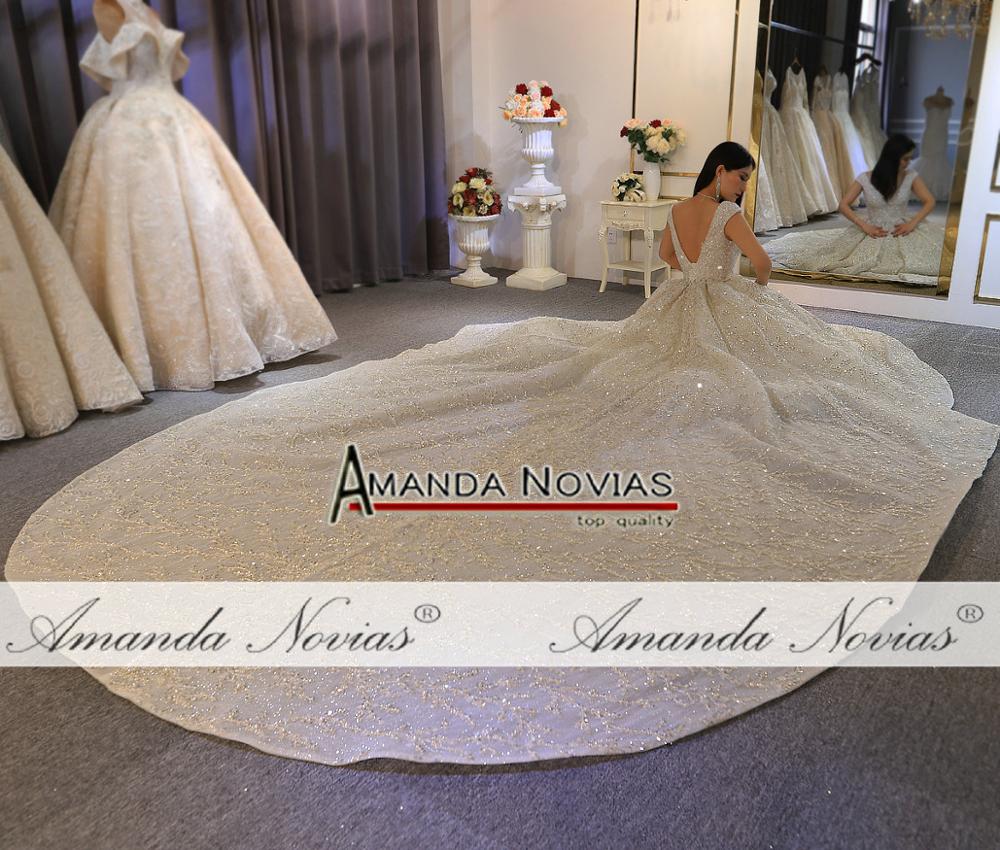 Luxury wedding dress by The Clothing Company Sydney featuring heavy beading, elegant bridal gown with intricate embellishments.