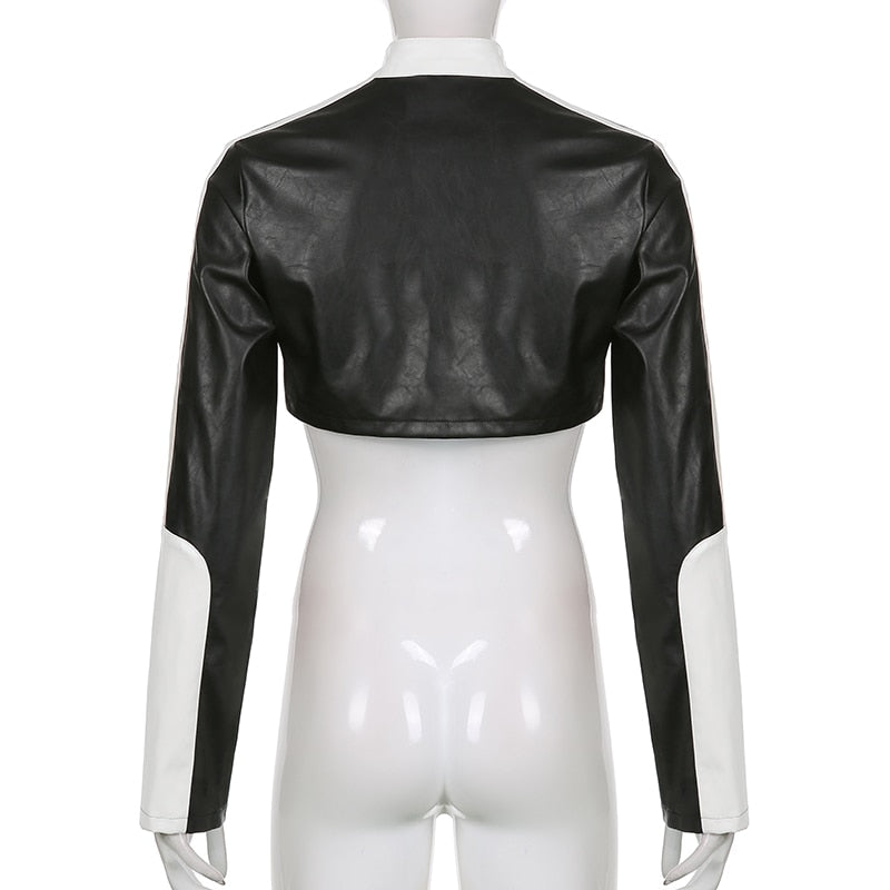 Punk style patchwork cropped PU leather jacket for women with zippers and contrast colors, ideal for autumn and winter.