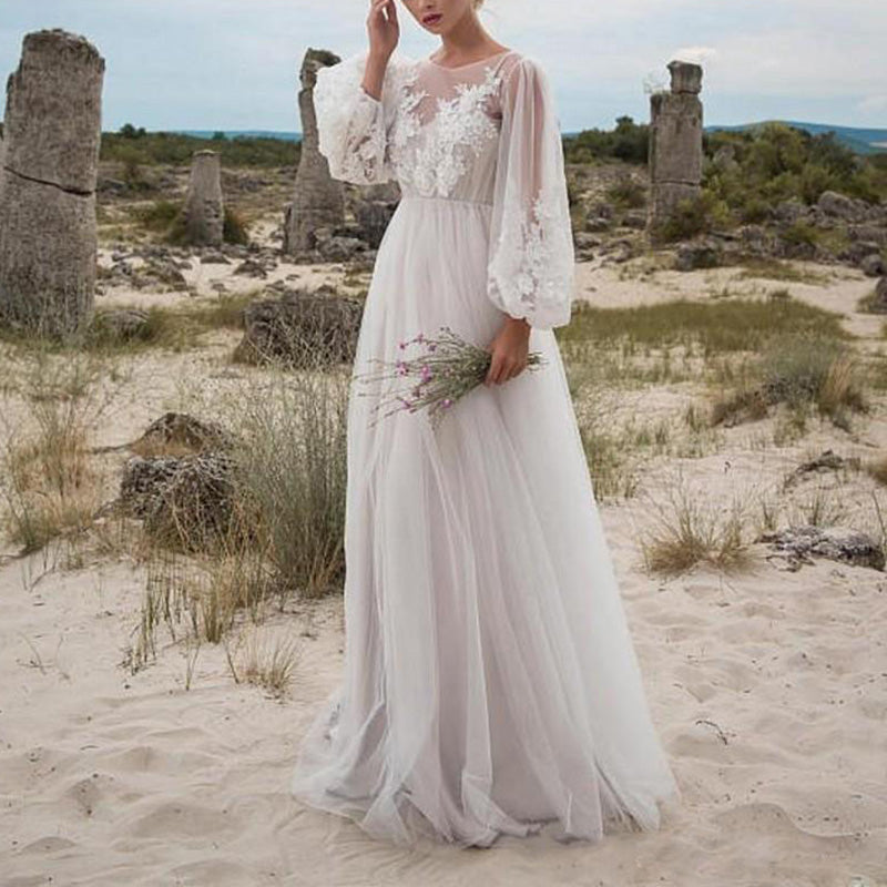 White long sleeve tulle wedding dress with embroidery and lace, featuring a maxi tunic style, ideal for summer vacations and beach weddings.