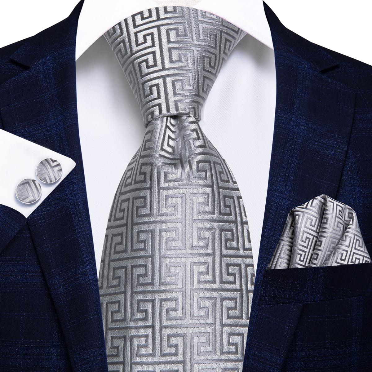 Set of three men's luxury silk paisley neckties, including cufflinks and pocket square, for formal and wedding accessories.