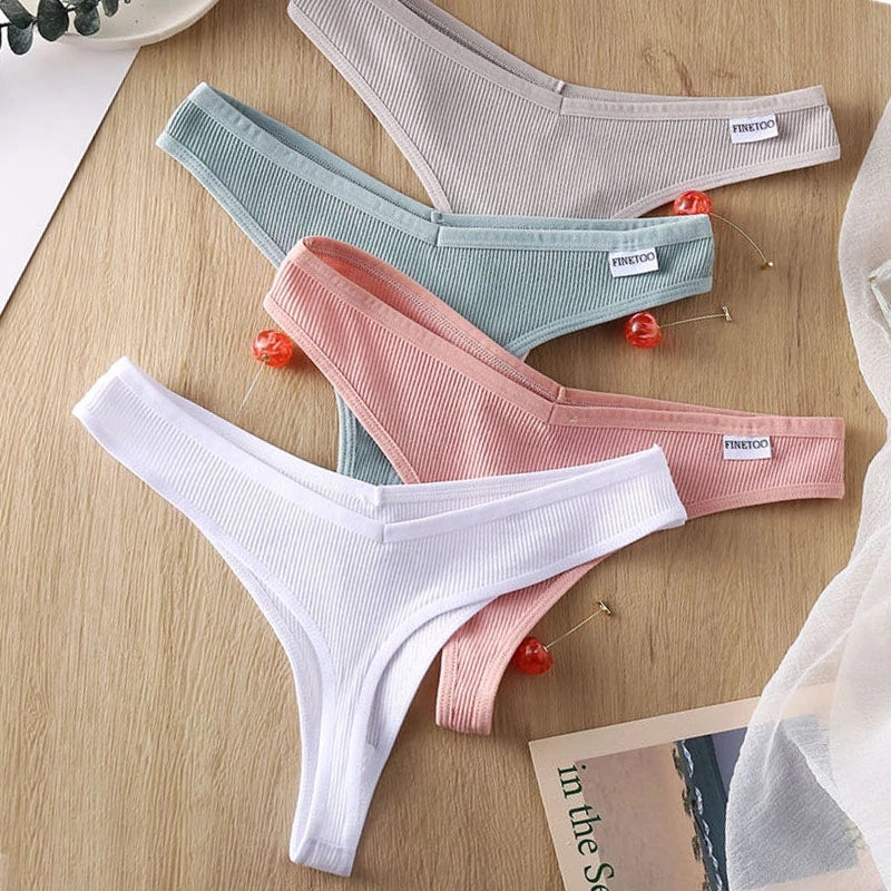 Three-pack of The Clothing Company Sydney cotton thong panties in eight colors, featuring V-waist design and comfortable lingerie fit.